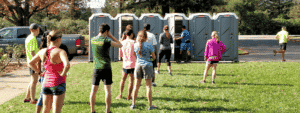runners waiting on a porta potty. Find a porta potty rental near you